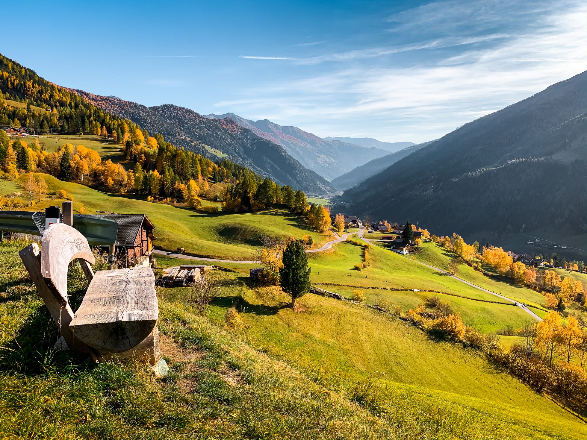 Bench with a view of the Austria mountains and valleys