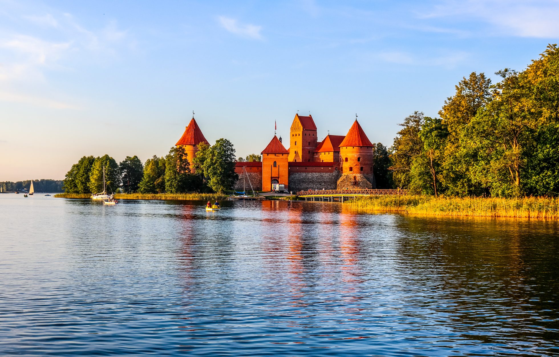 Trakai Castle at sunset; where to go on holiday in August?