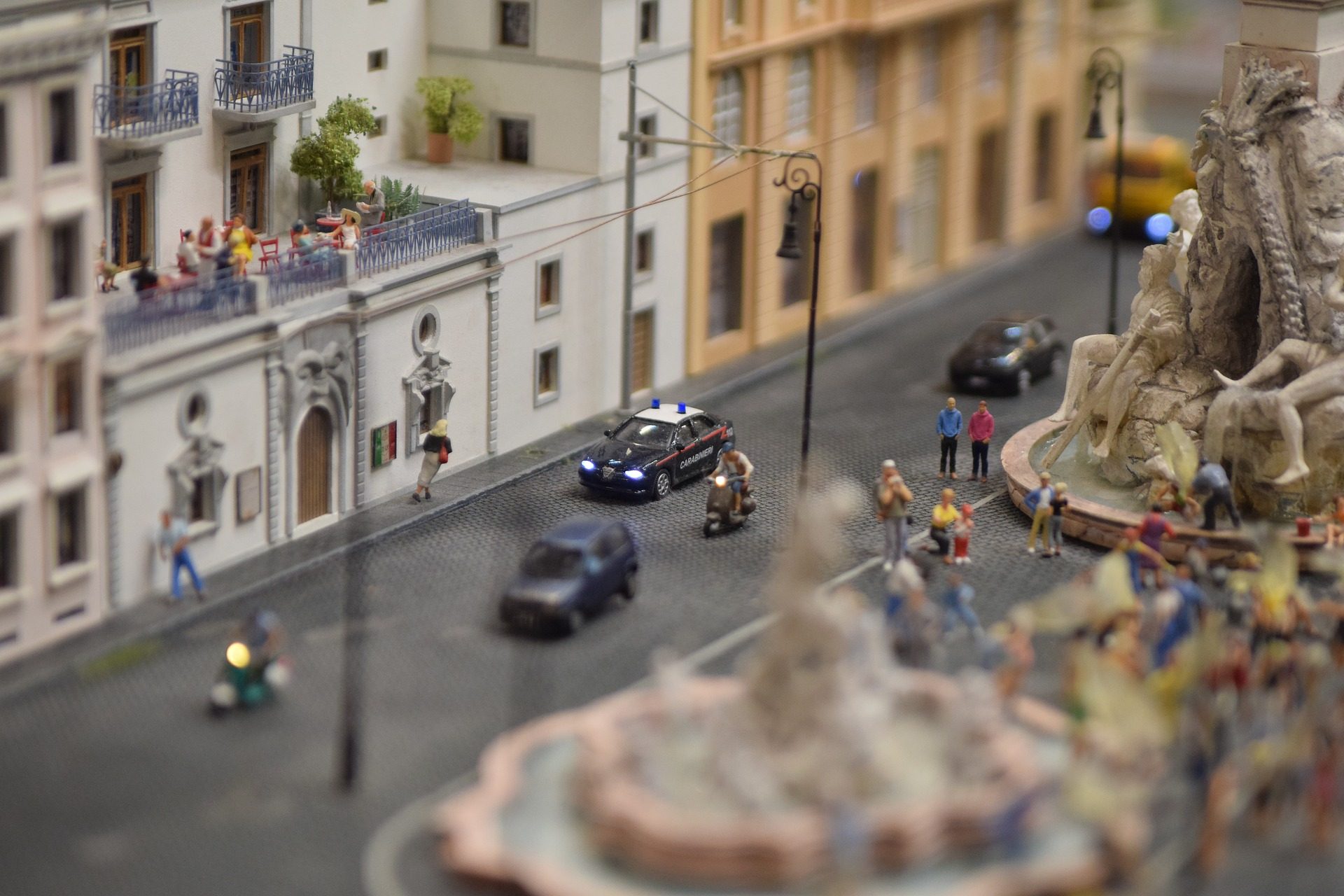 Miniature street with cars and pedestrians