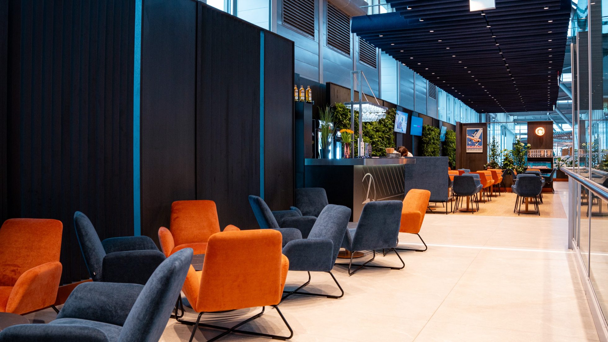 Elegant airport business lounge with comfortable seating and modern decor.
