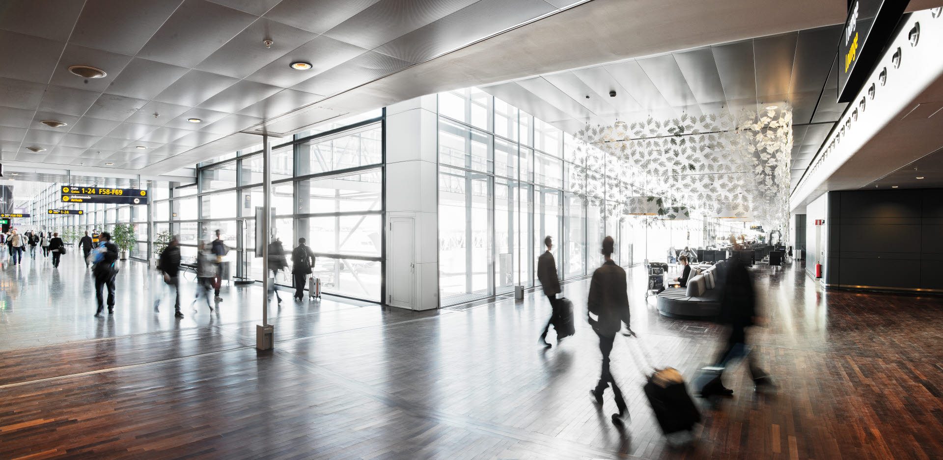 Airport interior, glass wall and wooden floors