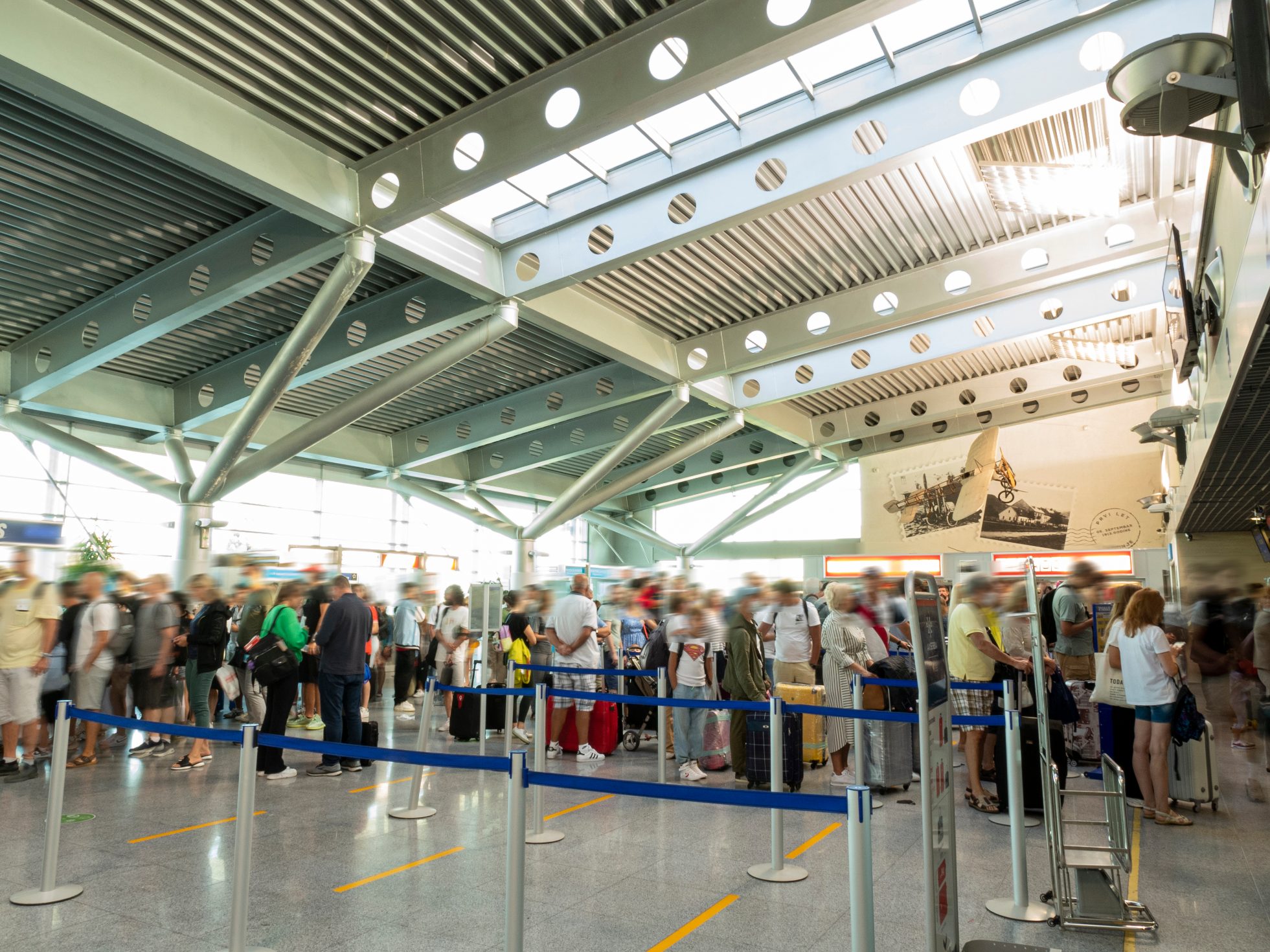 Line of people inside airport