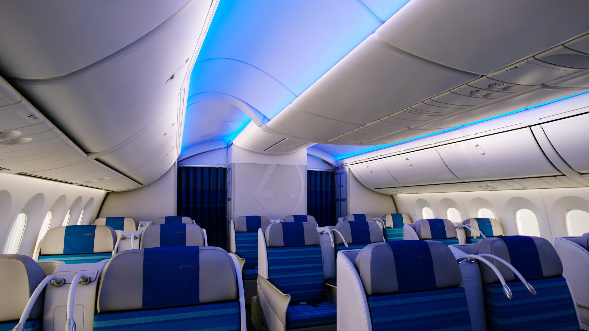 Wnętrze LOT Business Class na pokładzie Boeing 787 Dreamliner - rząd foteli i niebieskie podświetlenie sufitu kabiny
