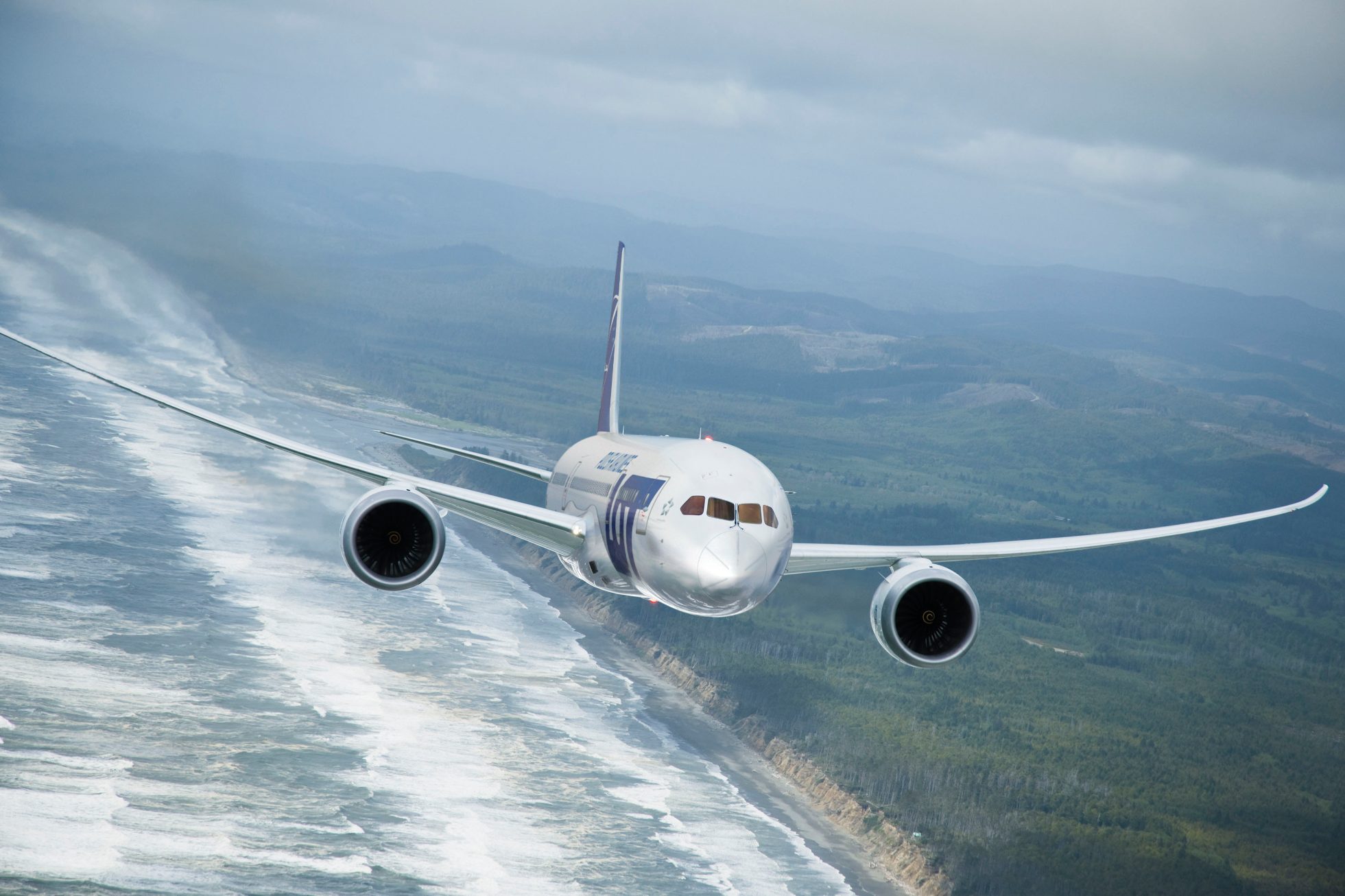 Boeing 787 of LOT flying above the shore