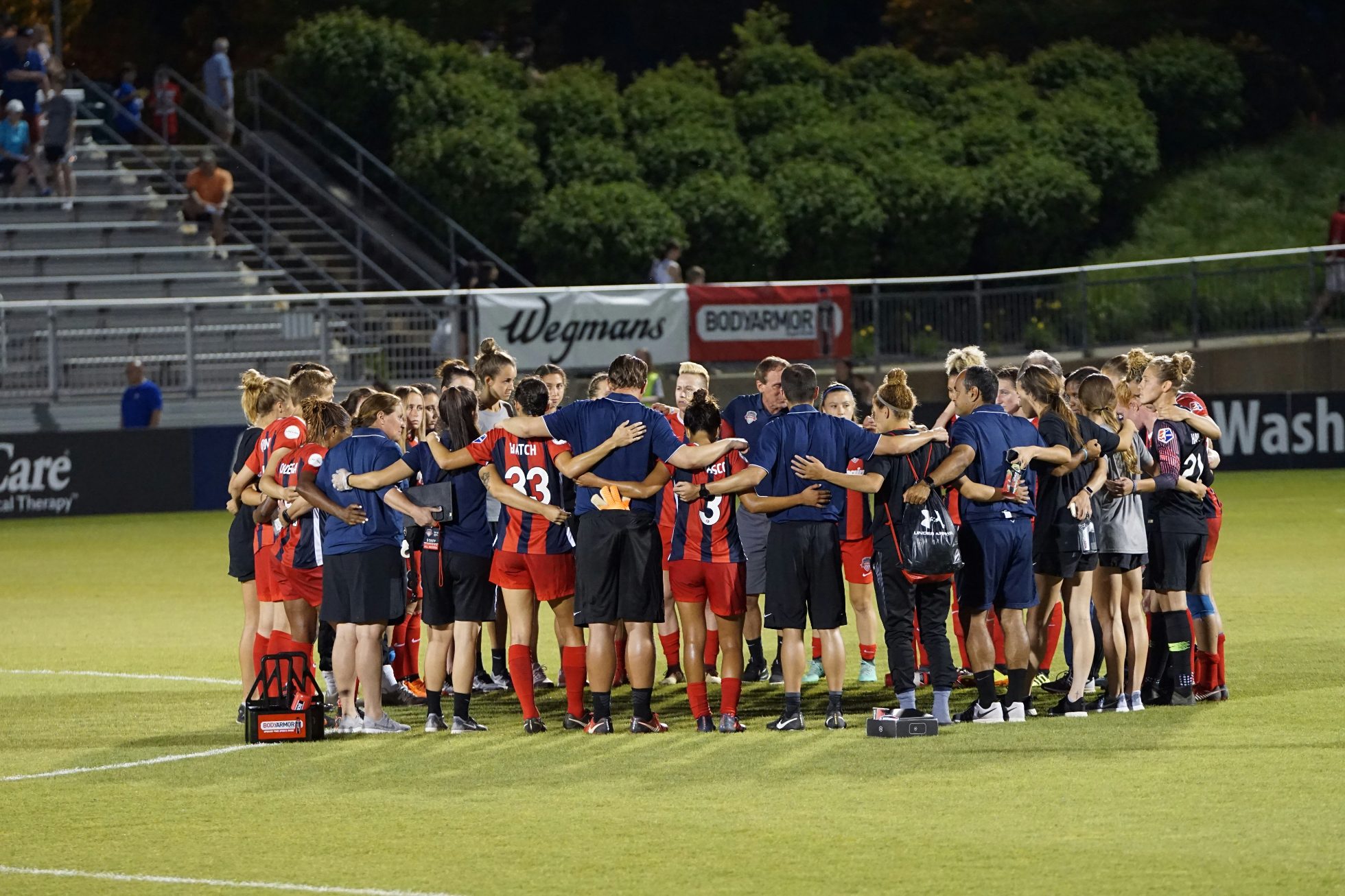 Soccer team standing in a circle