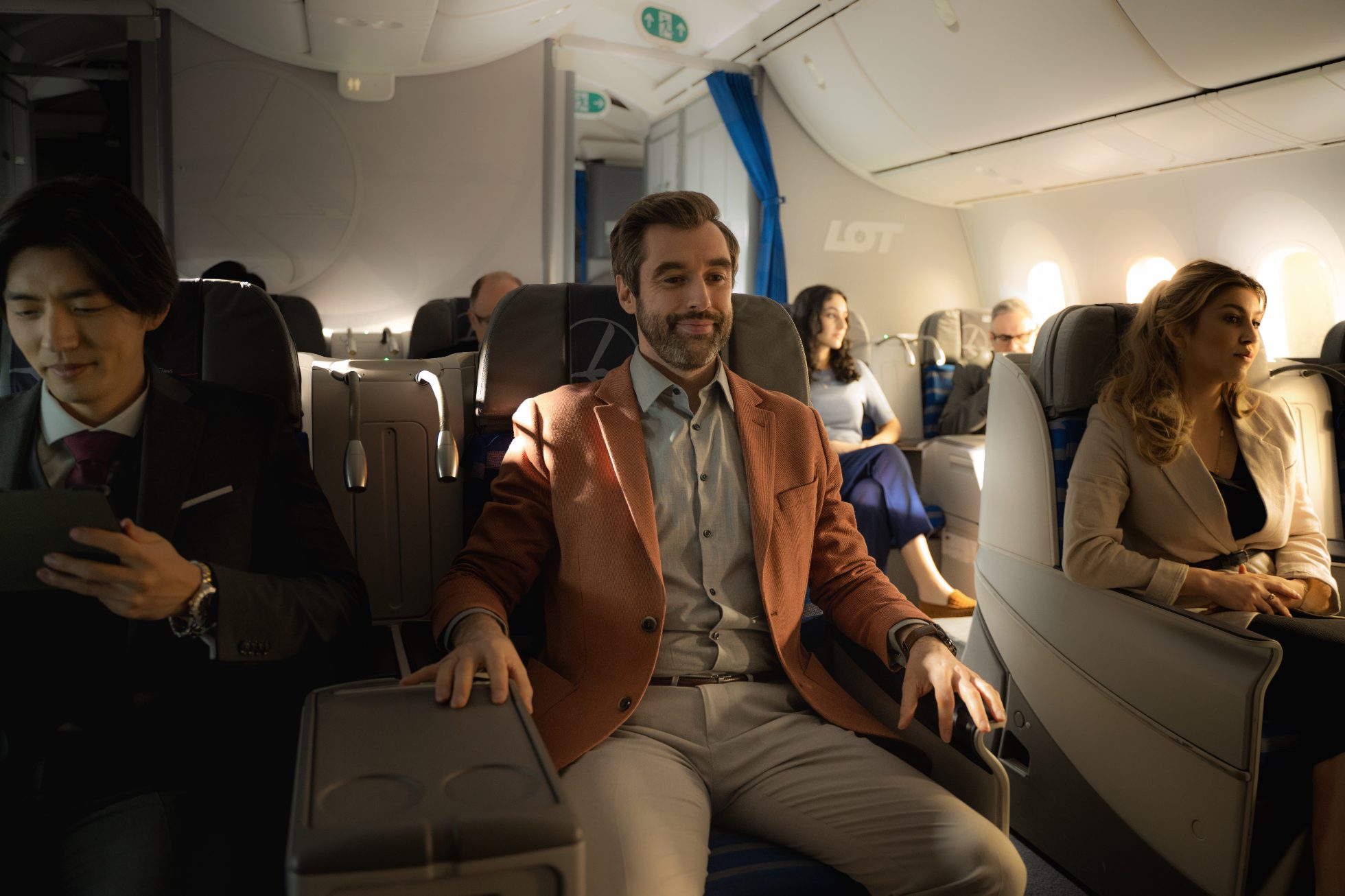 Passenger enjoys LOT Business Class benefits on board Dreamliner