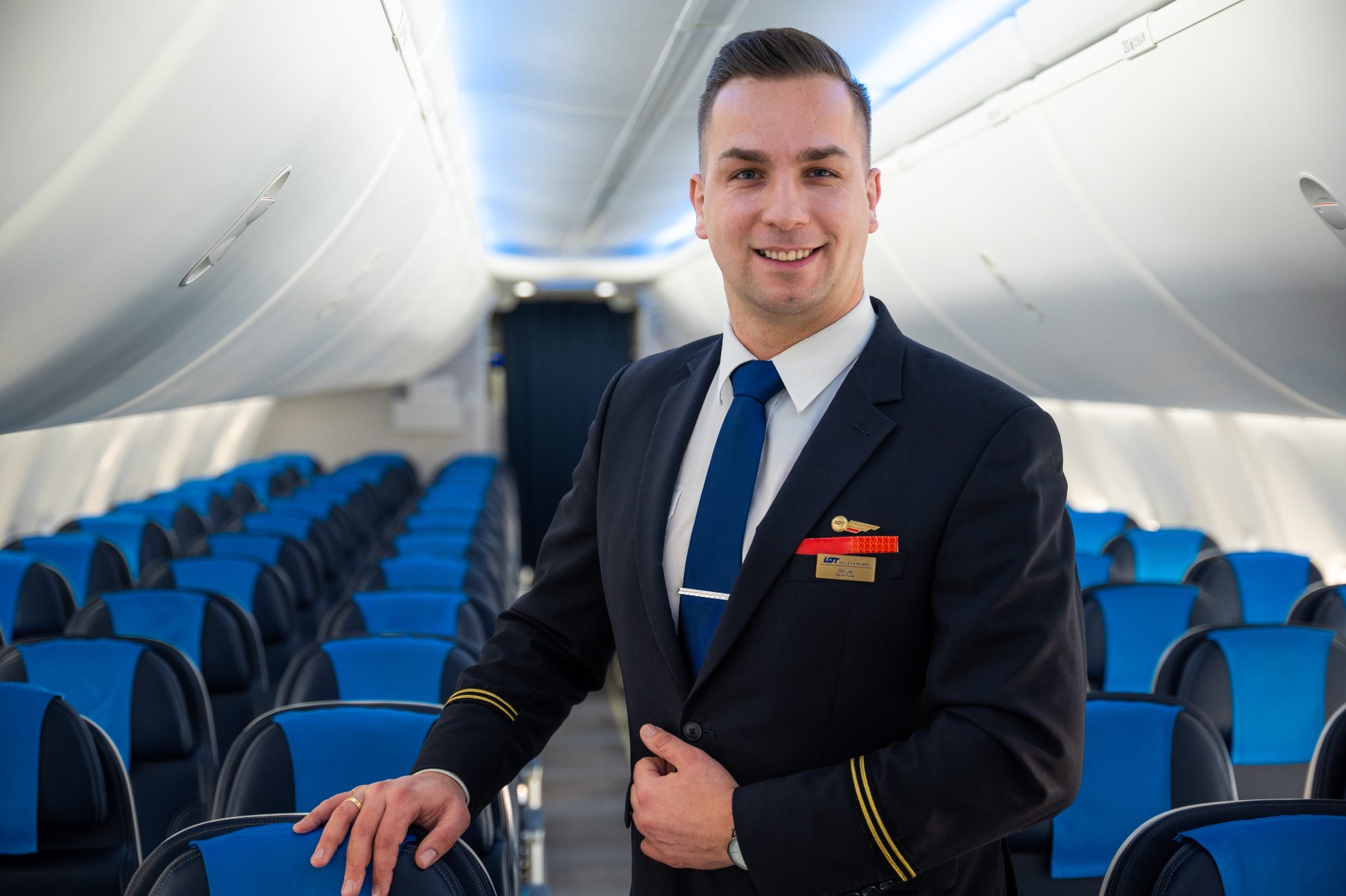 Smiling flight attendant on the plane
